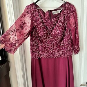 Gorgeous cranberry formal gown with beaded overlay.
